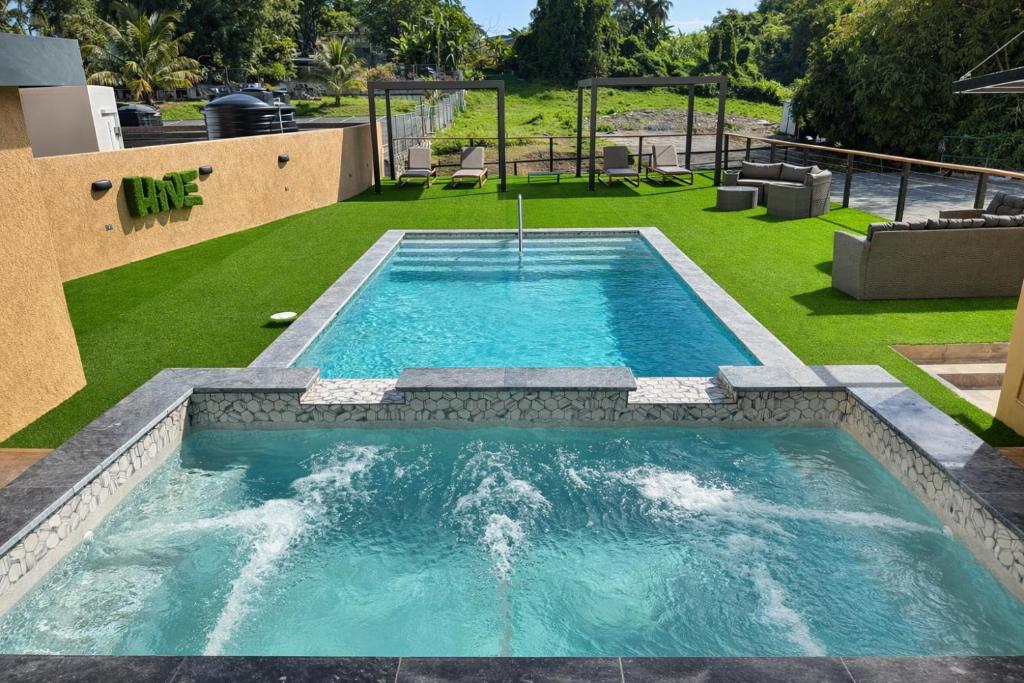 a swimming pool with a fountain in a yard at The Hive Boutique Hotel Double Room 109 in Scarborough