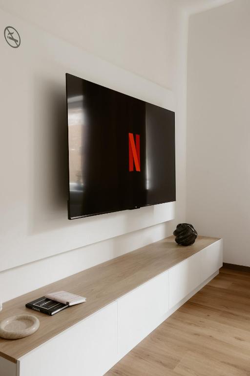 a flat screen tv on a white wall at Apartmány park in Poděbrady