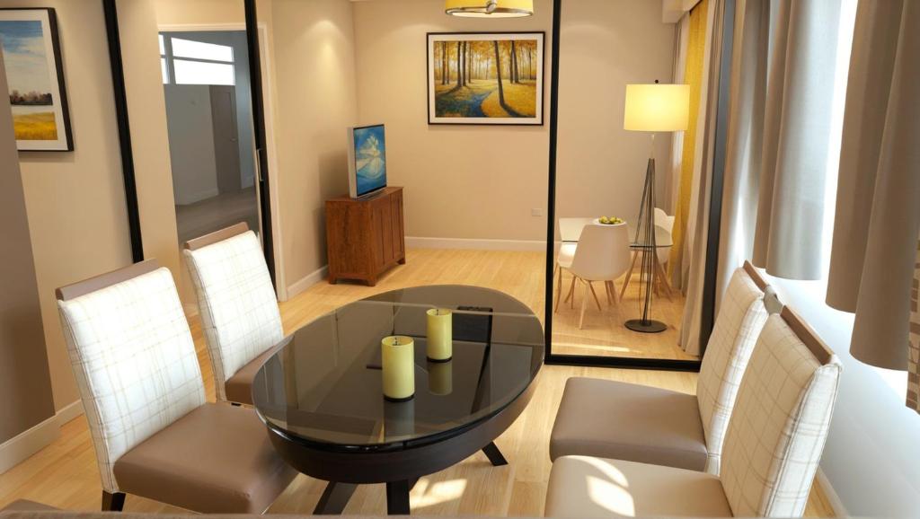 a dining room with a black table and chairs at Stylish 2, 3 and 5 Bedroom Entire Homes Near Art Deco and LA Hotspots in Los Angeles