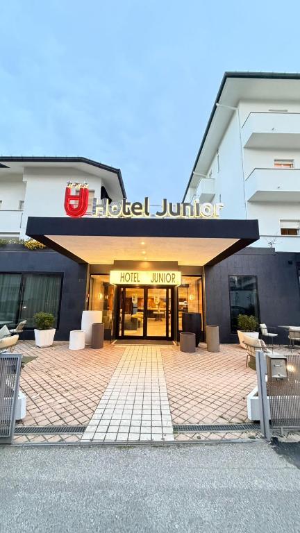 a hotel jumeirah building with a hotel lobby at Hotel Junior by OasiGroup Hotels in Rimini
