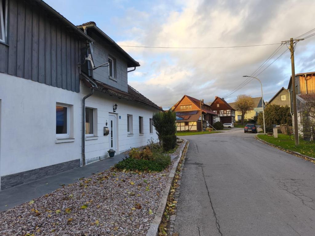 an empty street in a small town with houses at NEUBEGINN b in Bad Rodach