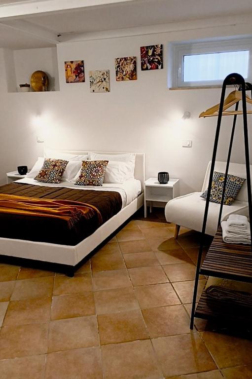 a bedroom with a large bed and a window at Regina Margherita in Crotone