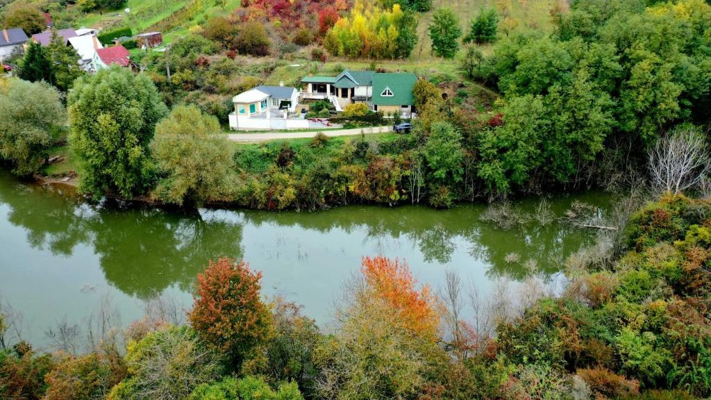 an aerial view of a house next to a river at VILLA Sebe in Mokrý Háj