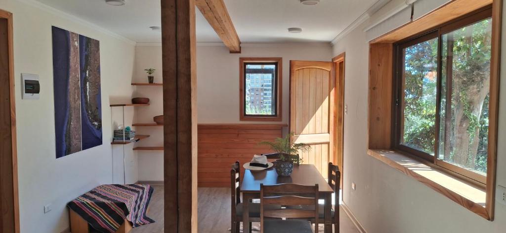 a room with a table and chairs in a house at El gran Jacarandá in Viña del Mar