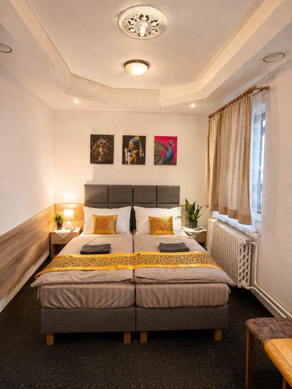 a bedroom with two beds in a room at Penzion u Fouska in Chodov