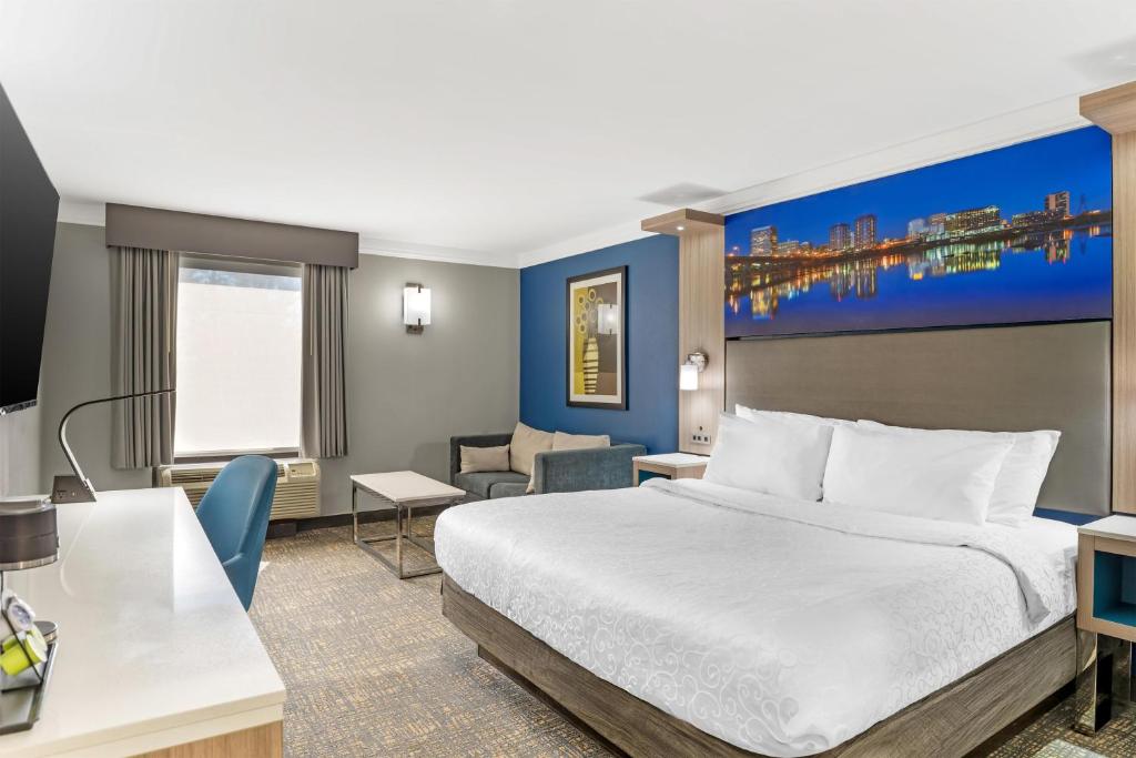 a hotel room with a bed and a desk at Best Western Plus Glen Allen Inn in Richmond