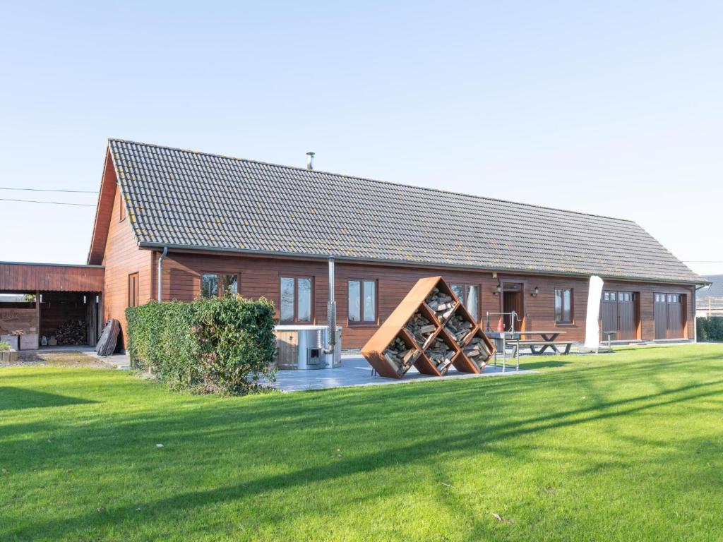 a building with a picnic table in front of it at ZweveZalig in Zwevezele