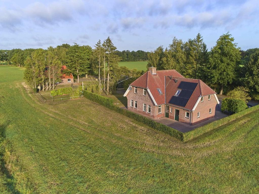 an overhead view of a house in a field at t Achterhoes in Neede