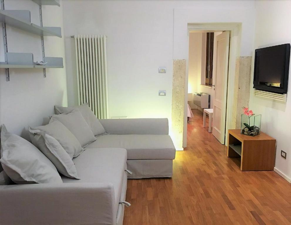 A television and/or entertainment centre at Navona Secret Suite
