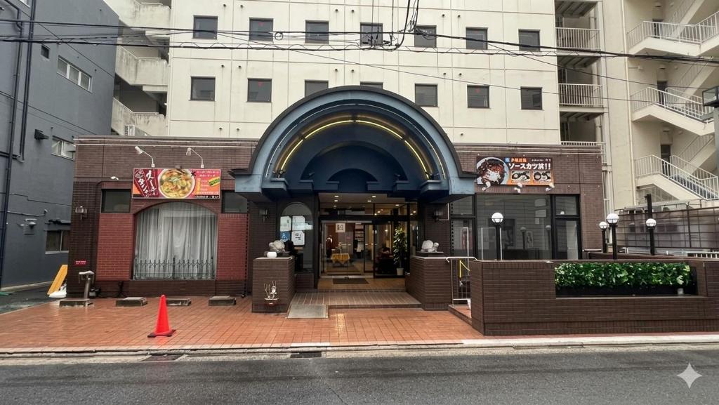 an entrance to a building with an arched doorway at スマートホテル福島駅前店 in Fukushima
