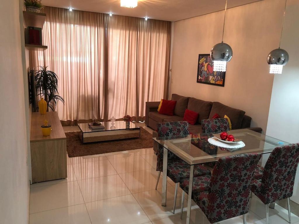 a living room with a couch and a table at Casa Central in São Raimundo Nonato