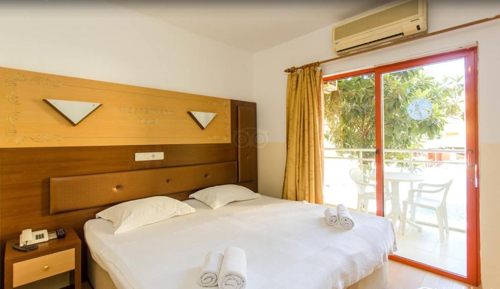 Postel nebo postele na pokoji v ubytování Wassermann Hotel