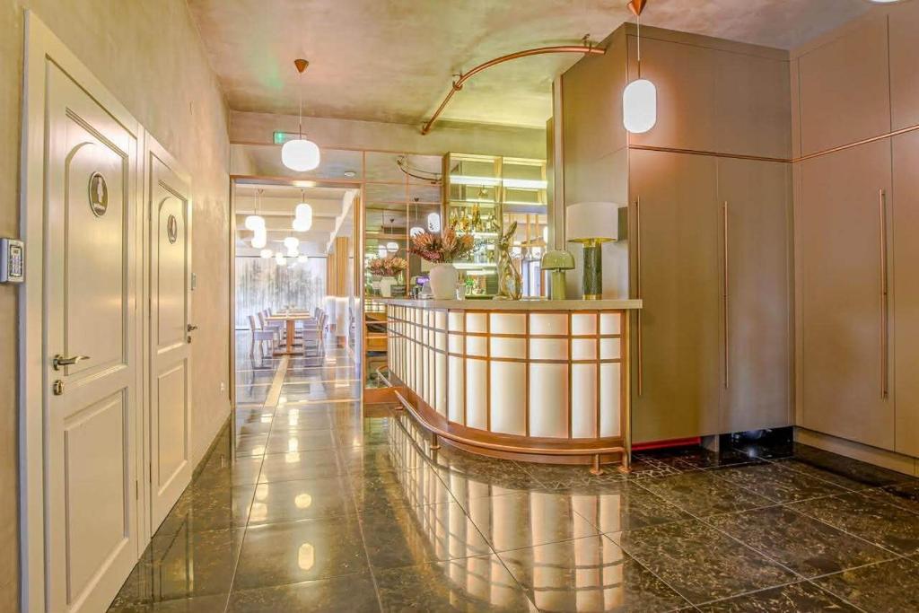 a lobby with a bar and a table in a building at Leśny Dwór in Radom
