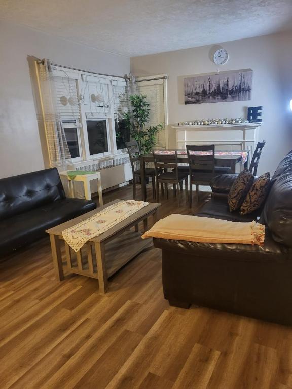 a living room with a couch and a table at Full house close to everything in Sydney