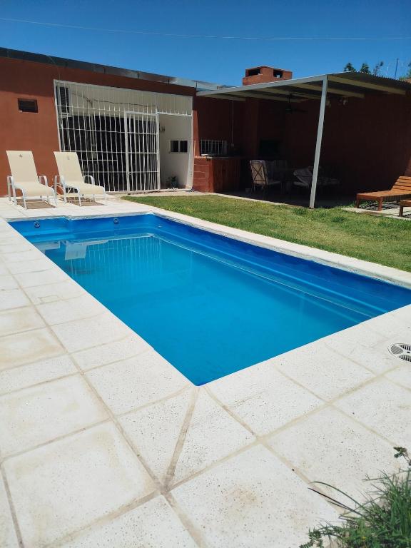 a swimming pool with blue water in a yard at mary in San Luis