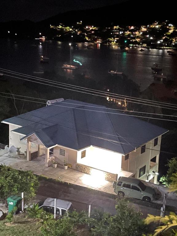a large blue tent over a house at night at Hibiscus House in Bequia