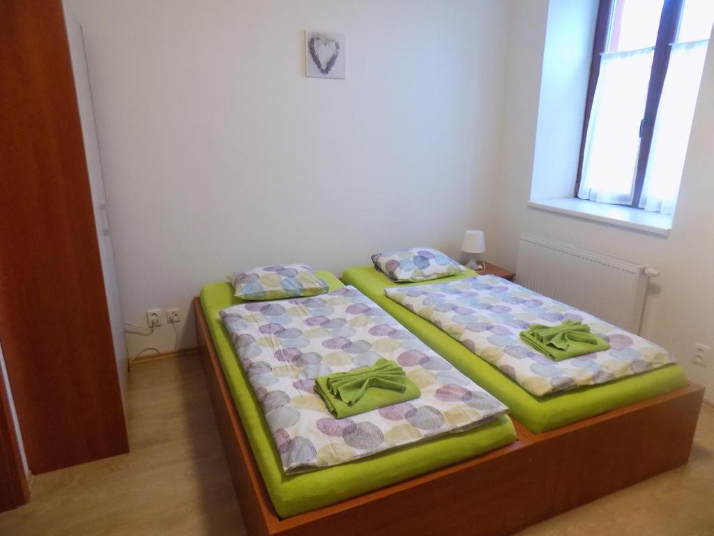 Postel nebo postele na pokoji v ubytování Agropenzion U Bartousku