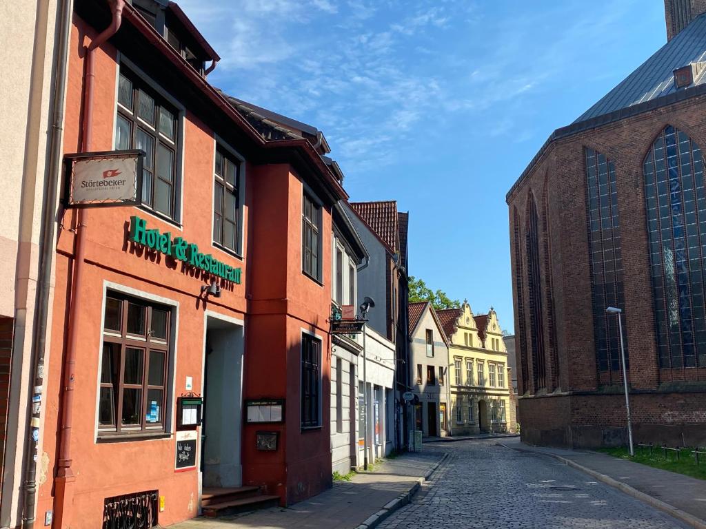 an empty street in an old town with buildings at Norddeutscher Hof in Stralsund