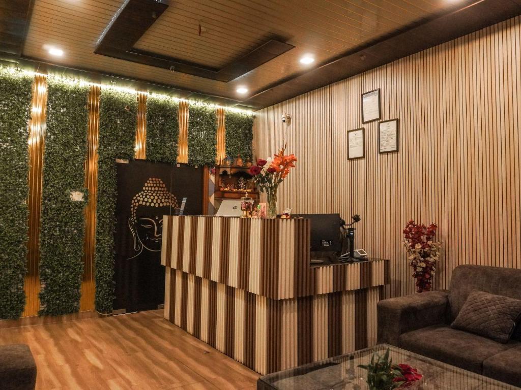 a living room with a computer and a couch at The Ark Spalon Spa Gomti Nagar in Lucknow