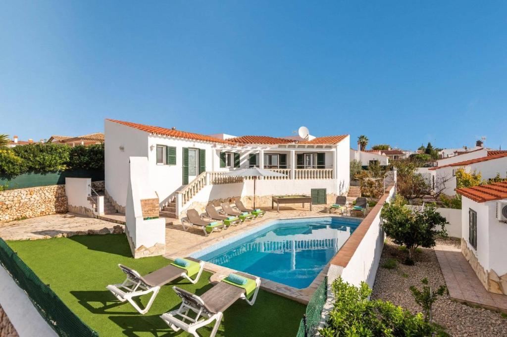 an aerial view of a house with a swimming pool at Villa Santi I by Villa Plus in Cala en Porter