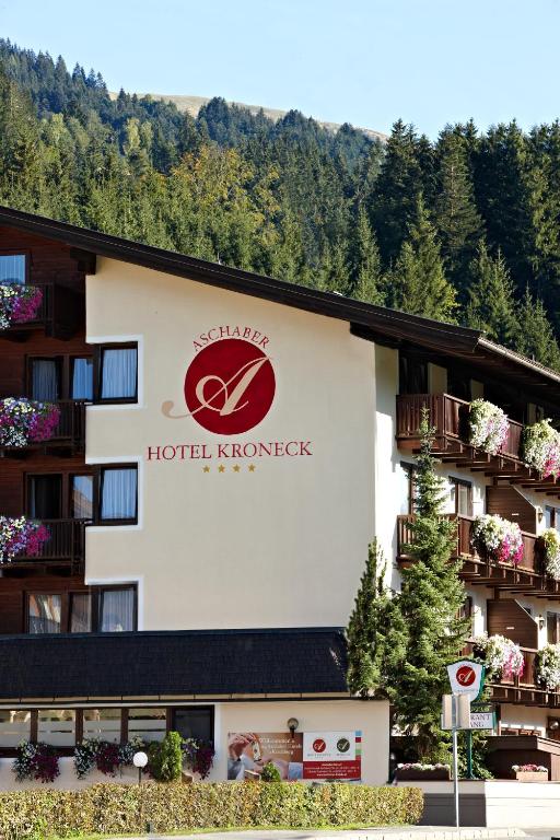 a hotel kirsch knerker sign on the side of a building at Hotel Kroneck in Kirchberg in Tirol