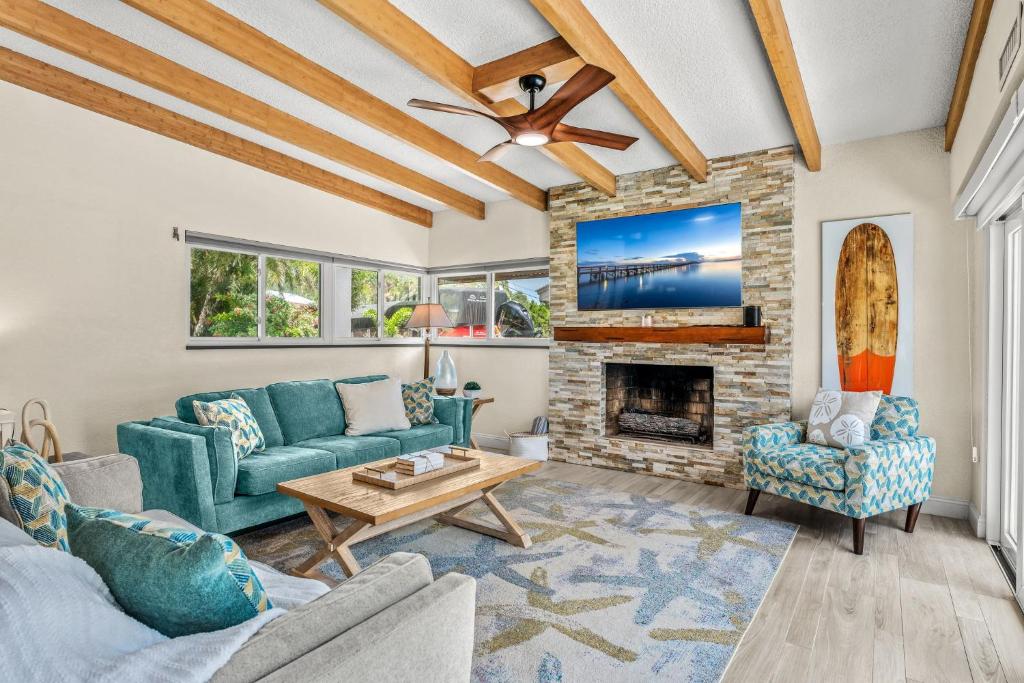 a living room with a couch and a fireplace at 464 Indian Creek Dr in Cocoa Beach