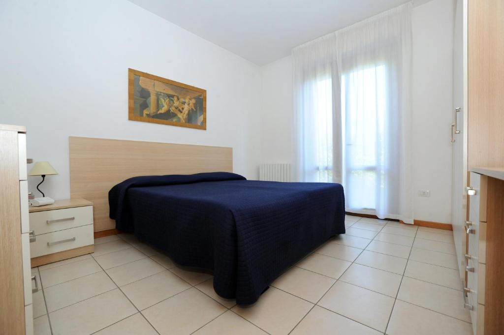 Posteľ alebo postele v izbe v ubytovaní Residence Sole del Conero