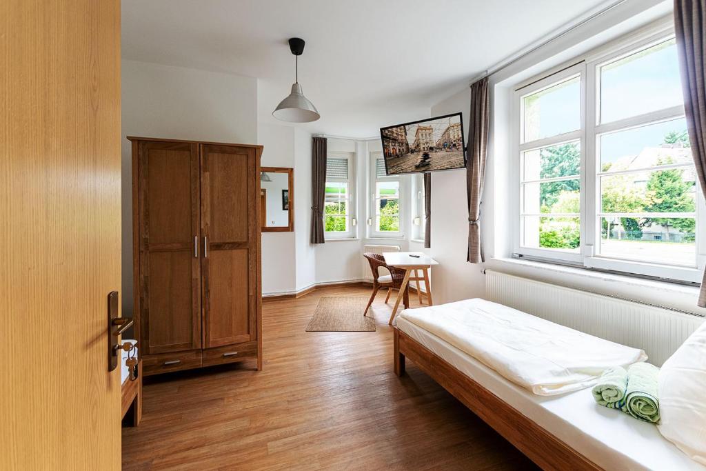 a bedroom with a bed and a window at Monteurzimmer Jerichow in Jerichow