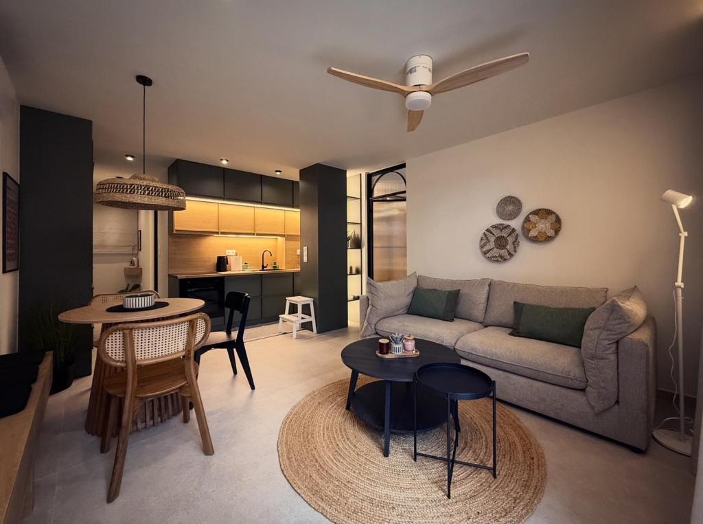 a living room with a couch and a table at Central Luxury Sea View Apartment in Chalkida