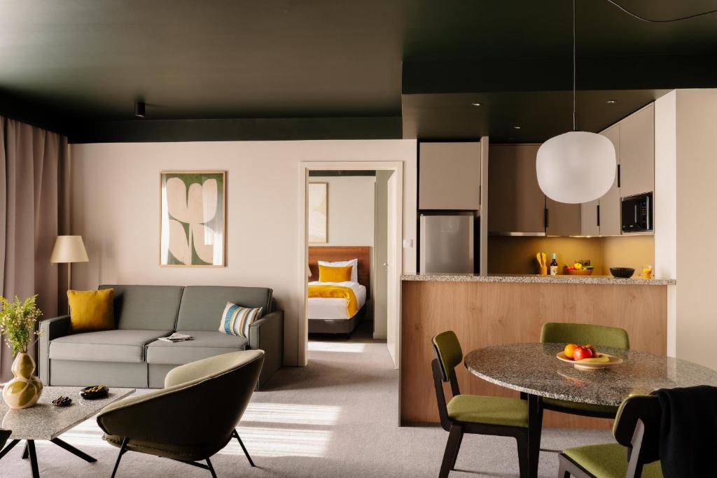a living room with a couch and a table at Adina Apartment Hotel Budapest in Budapest