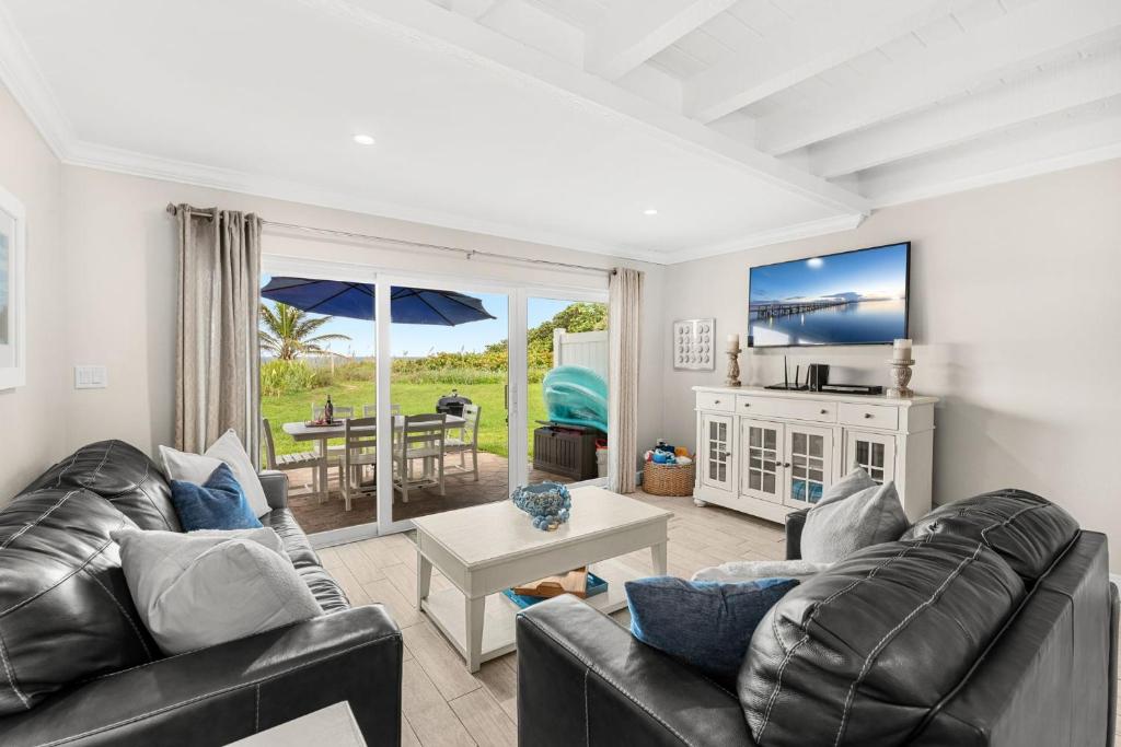 a living room with a couch and a table at 1045 Wave Crest Avenue in Indialantic