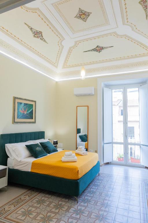 a bedroom with a bed and a coffered ceiling at Tropea Belle Époque in Tropea