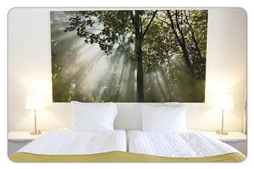 Postel nebo postele na pokoji v ubytování Hotell Tinget
