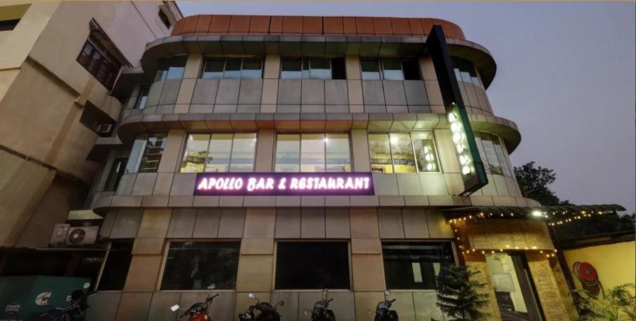 a building with a sign on the front of it at Hotel Apollo in Guwahati