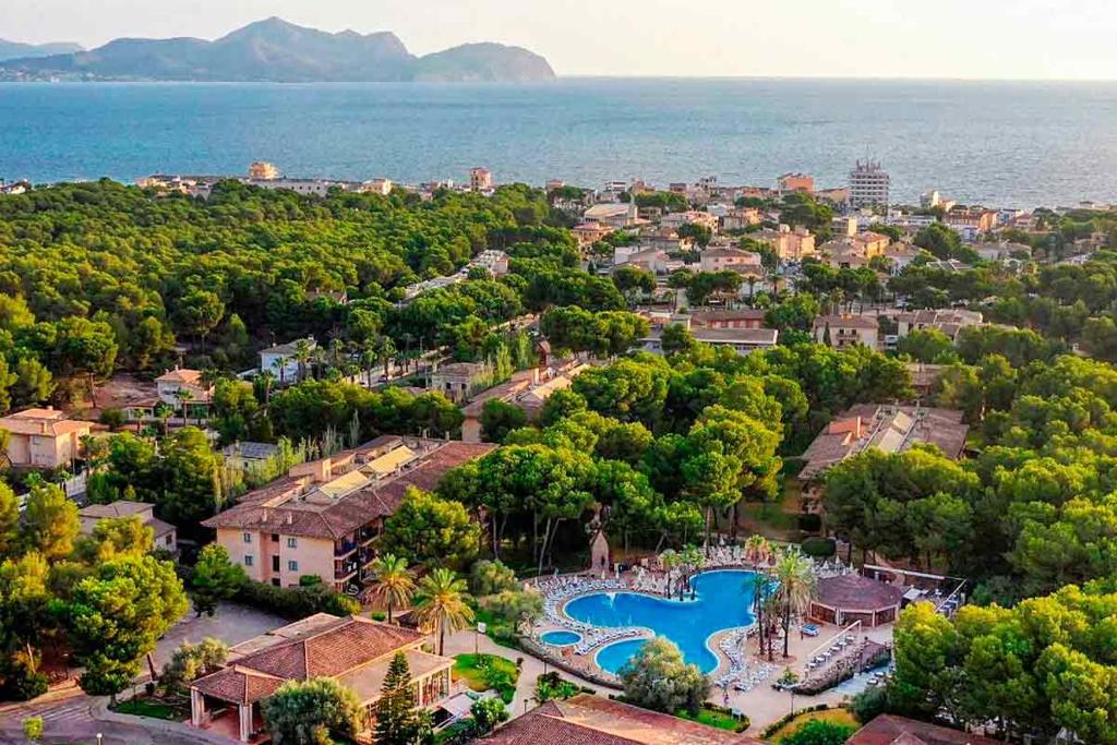 an aerial view of a resort with a swimming pool at Caprice Vell Mari Hotel & Resort - New Opening 2026 in Can Picafort