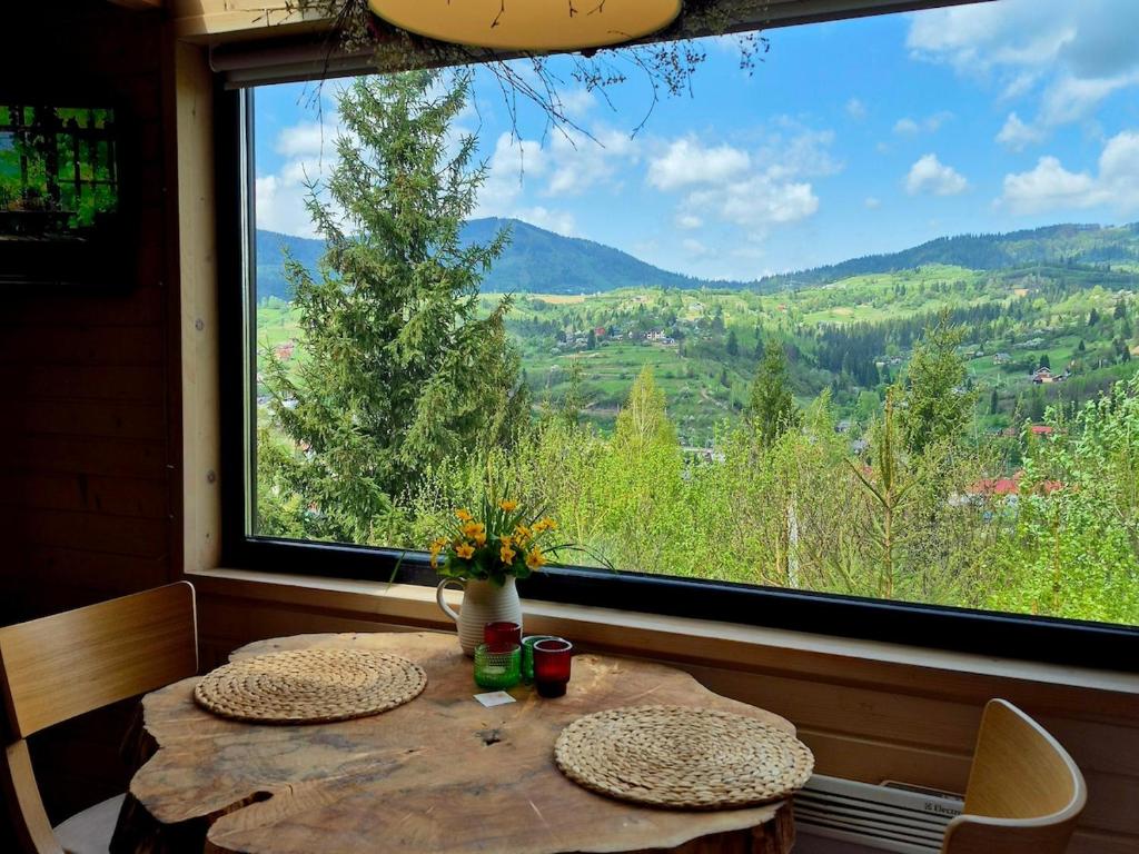 a table in a room with a large window at Miko II in Slavske