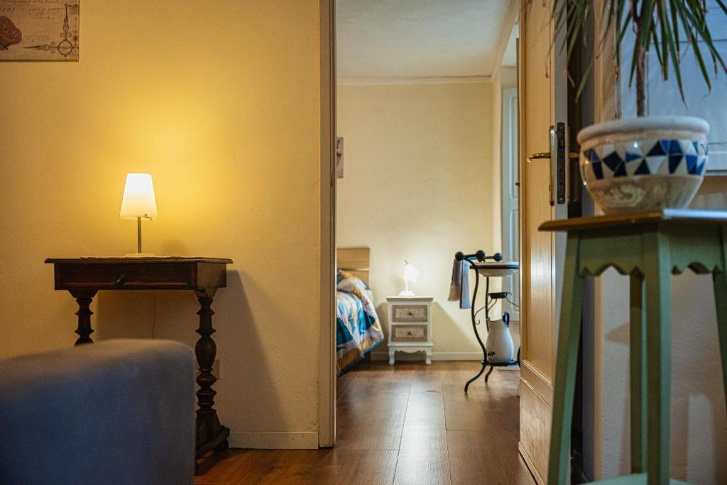 a room with a hallway with a table and a lamp at Teatro in Anghiari