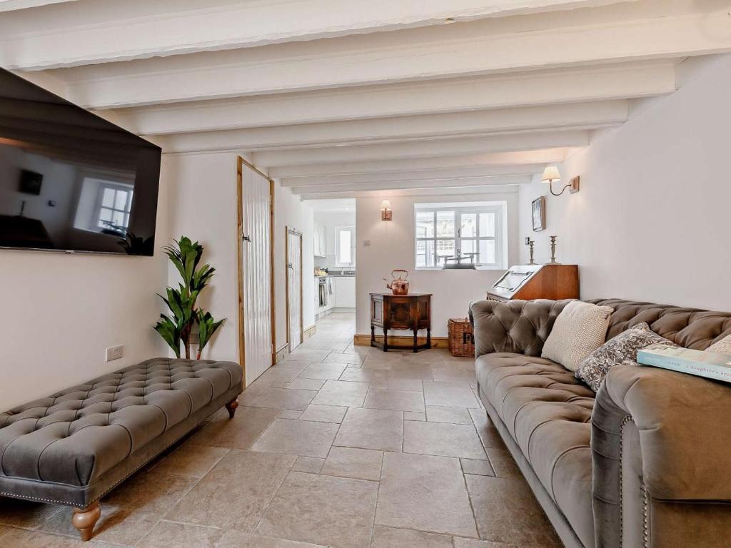 a living room with a couch and a table at 1 Bed in Barnstaple oc-91612 in Bishops Tawton