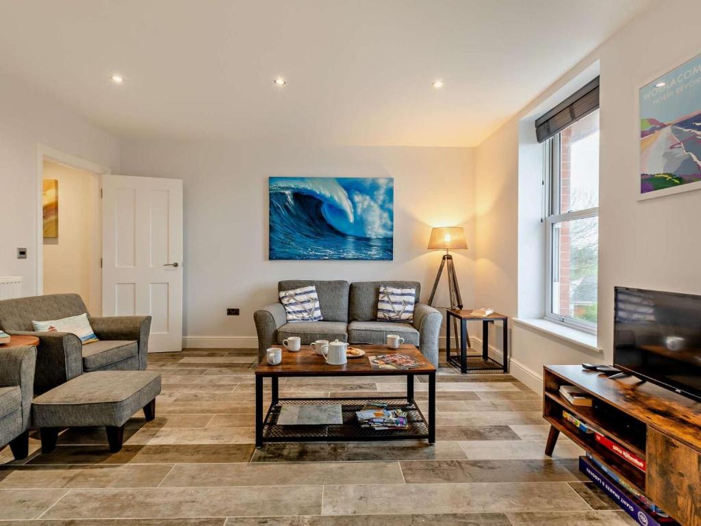 a living room with a couch and a tv at 2 Bed in Woolacombe oc-90798 in Mortehoe