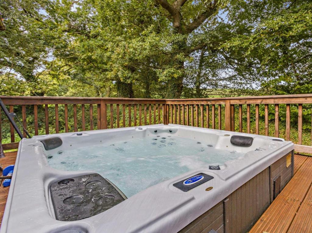 a hot tub on the deck of a house at 3 Bed in Okehampton oc-95636 in Okehampton