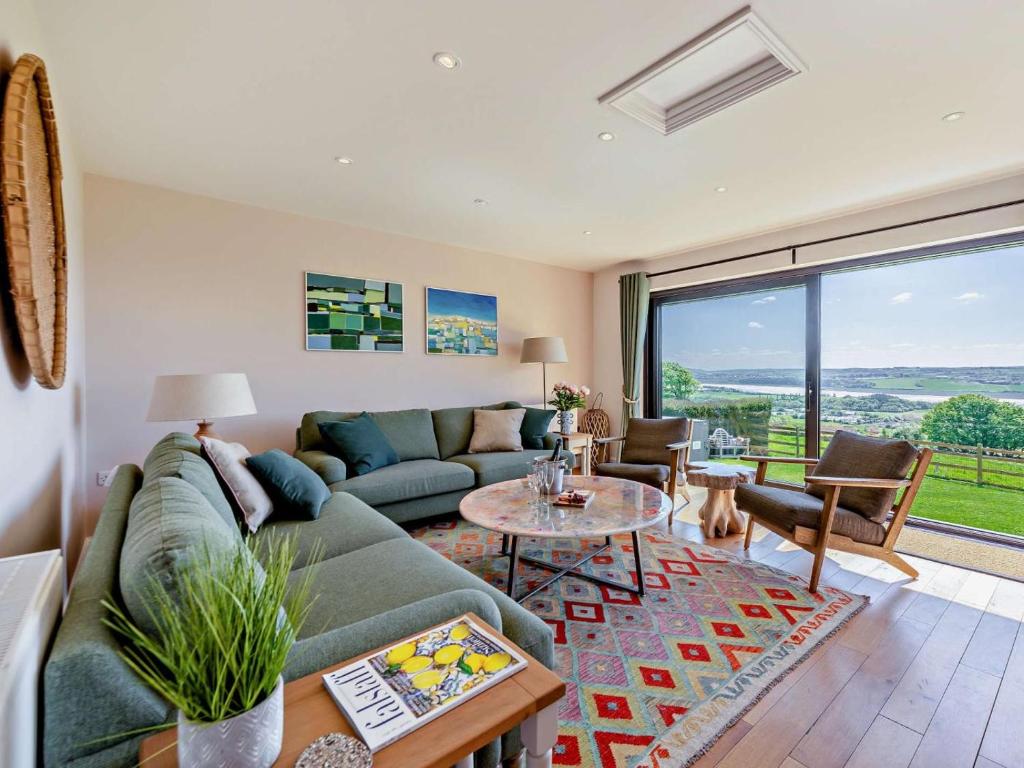 a living room with a couch and a table at 3 Bed in Barnstaple oc-53109 in Braunton