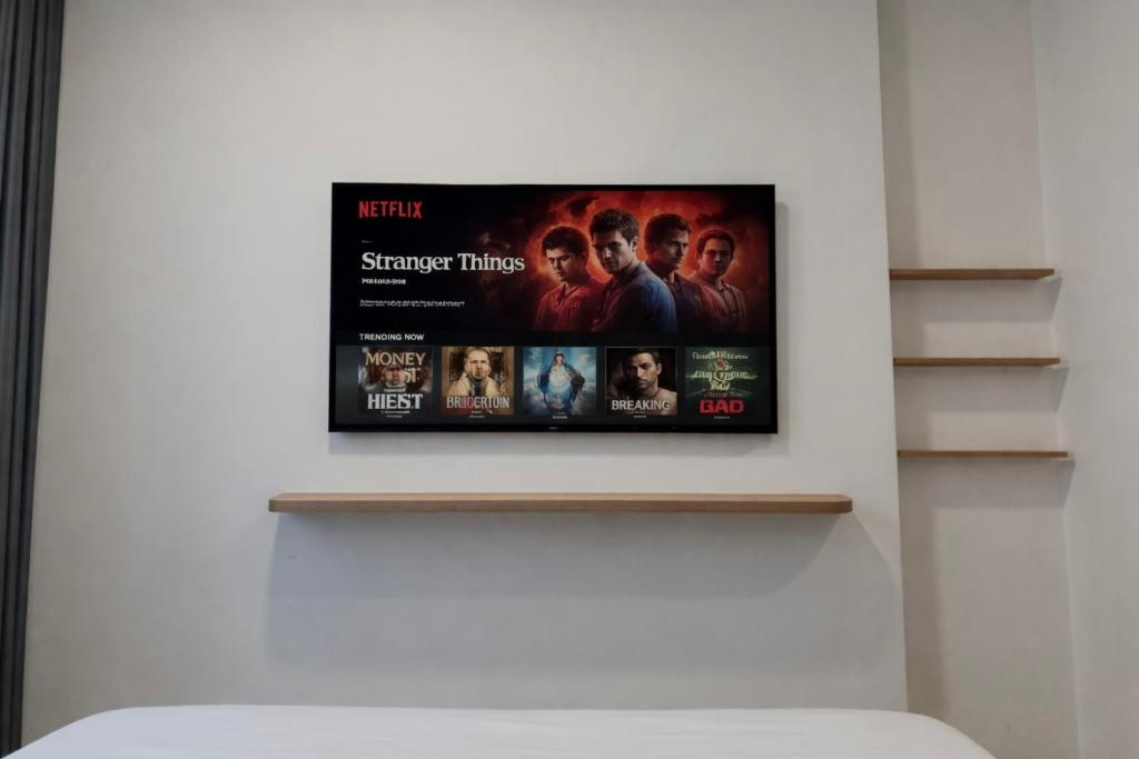 a flat screen tv hanging on a wall at KSWL Residence in Long Bình