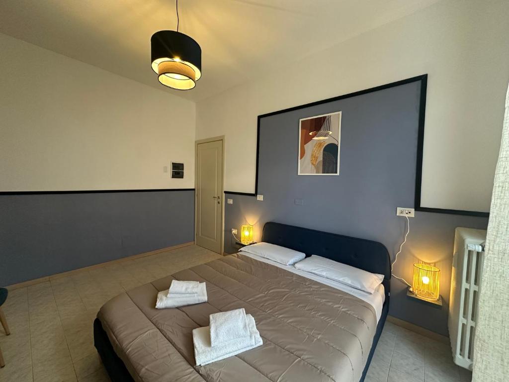 a bedroom with a bed with two pillows on it at FEEL - Bellavista Suites in Bergamo