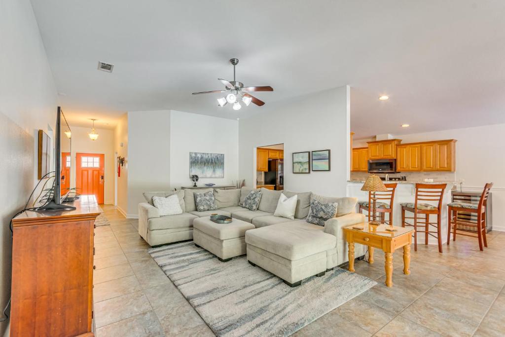 a living room with a couch and a table at Private Pool + Patio: Pensacola Family Home! in Perdido Key
