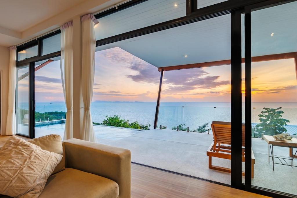 a living room with a view of the ocean at Shamgrila - Panoramic Sea View in Ko Phangan