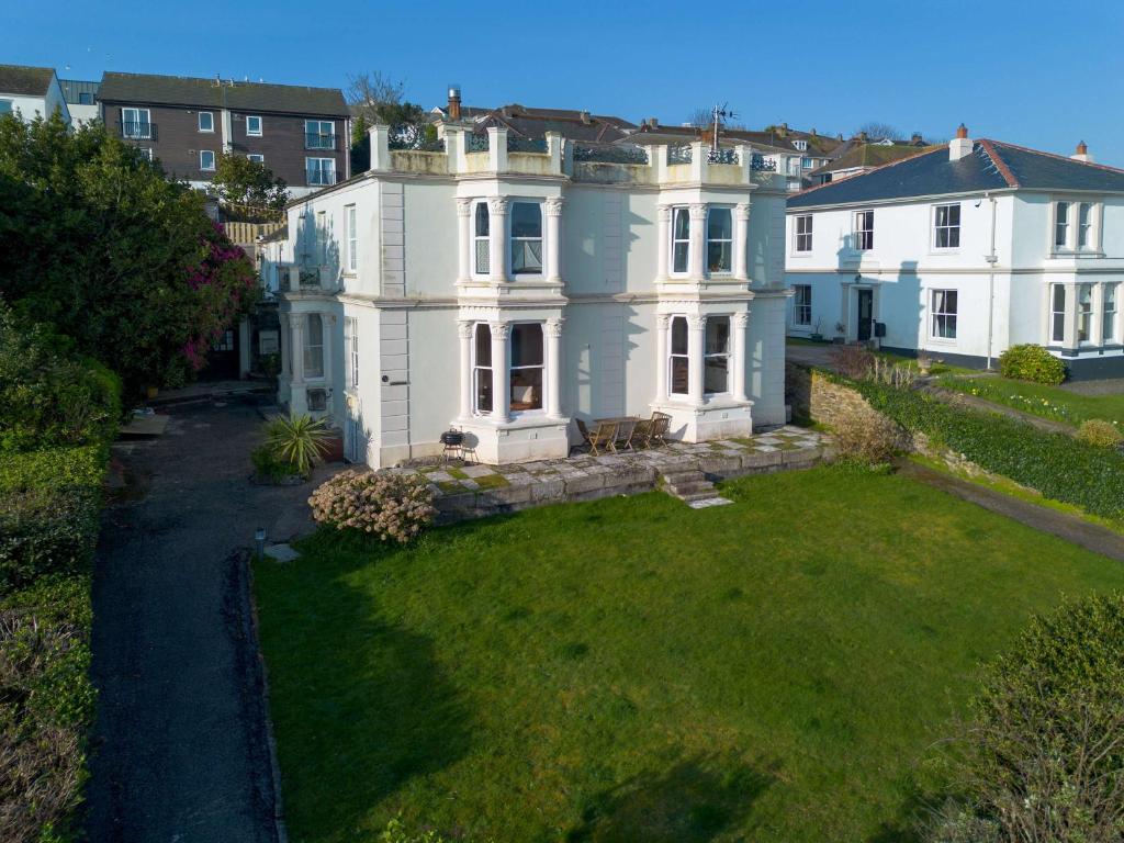 an aerial view of a large white house at Riversdale in Falmouth