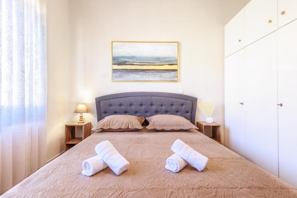 a bedroom with a bed with two pillows on it at Philoxenia House in Sidirokastro