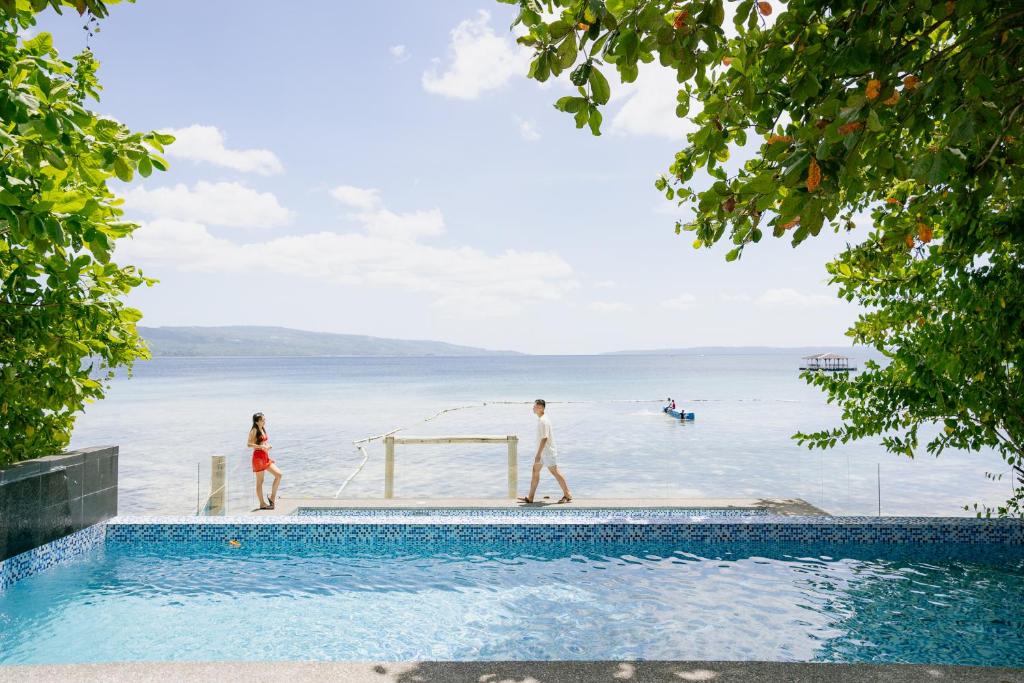 a group of people playing soccer in the water at La Patria Chica in Sampong