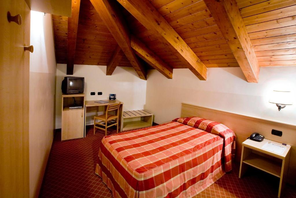 Postel nebo postele na pokoji v ubytování Hotel Gallia