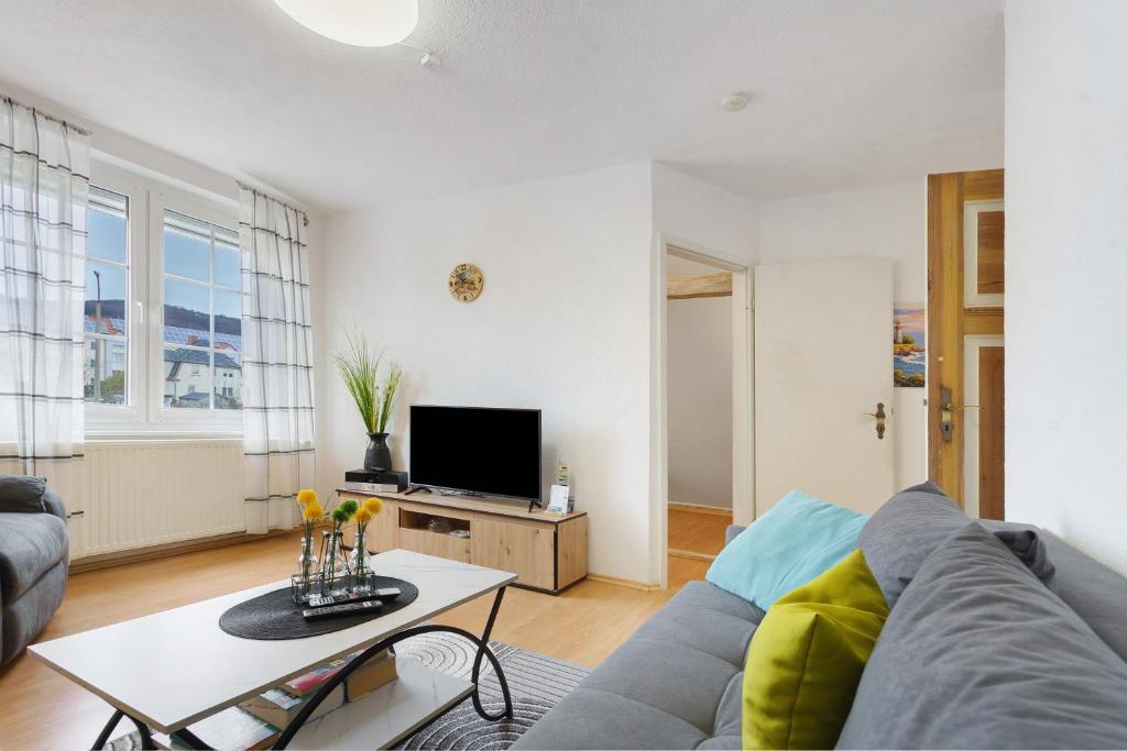 a living room with a couch and a table at Ferienwohnung oberhalb vom Hafen 2 in Sassnitz